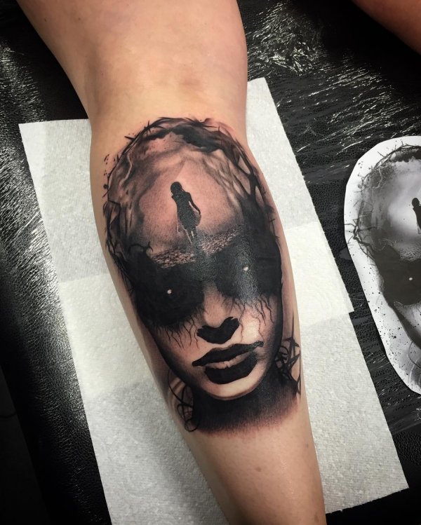 Eye-catching tattoo design inked in black. Creepy Tattoo Ideas
