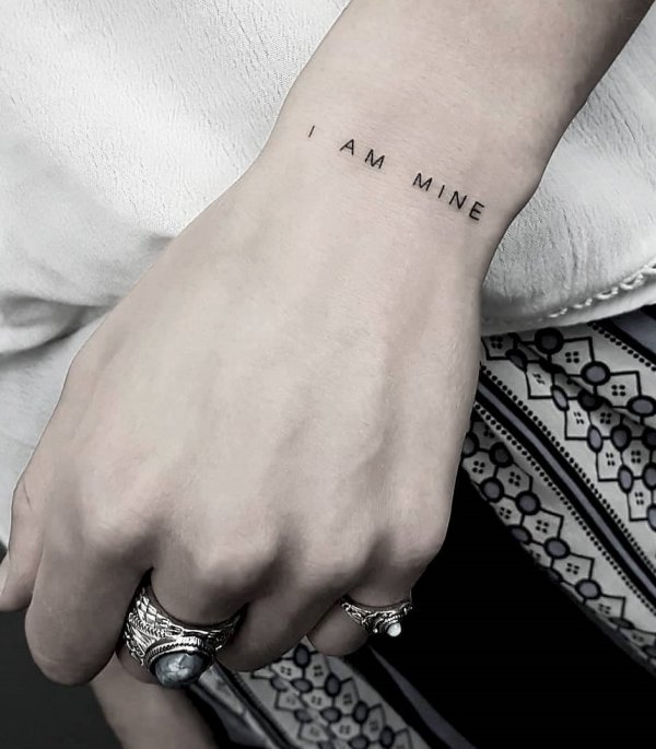 I Am Mine fine line wrist tattoo. Pic by fraukekatze
