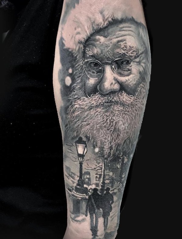 Rocking black and white Santa tattoo