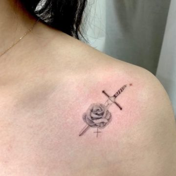 Rose with knife inked on shoulder. Pic by dolim_tat