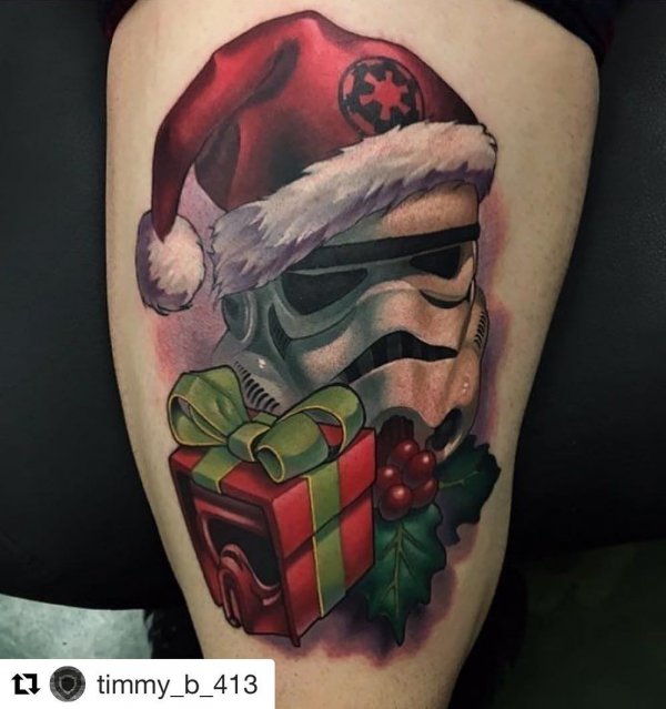 Swanky Christmas tattoo on thigh.