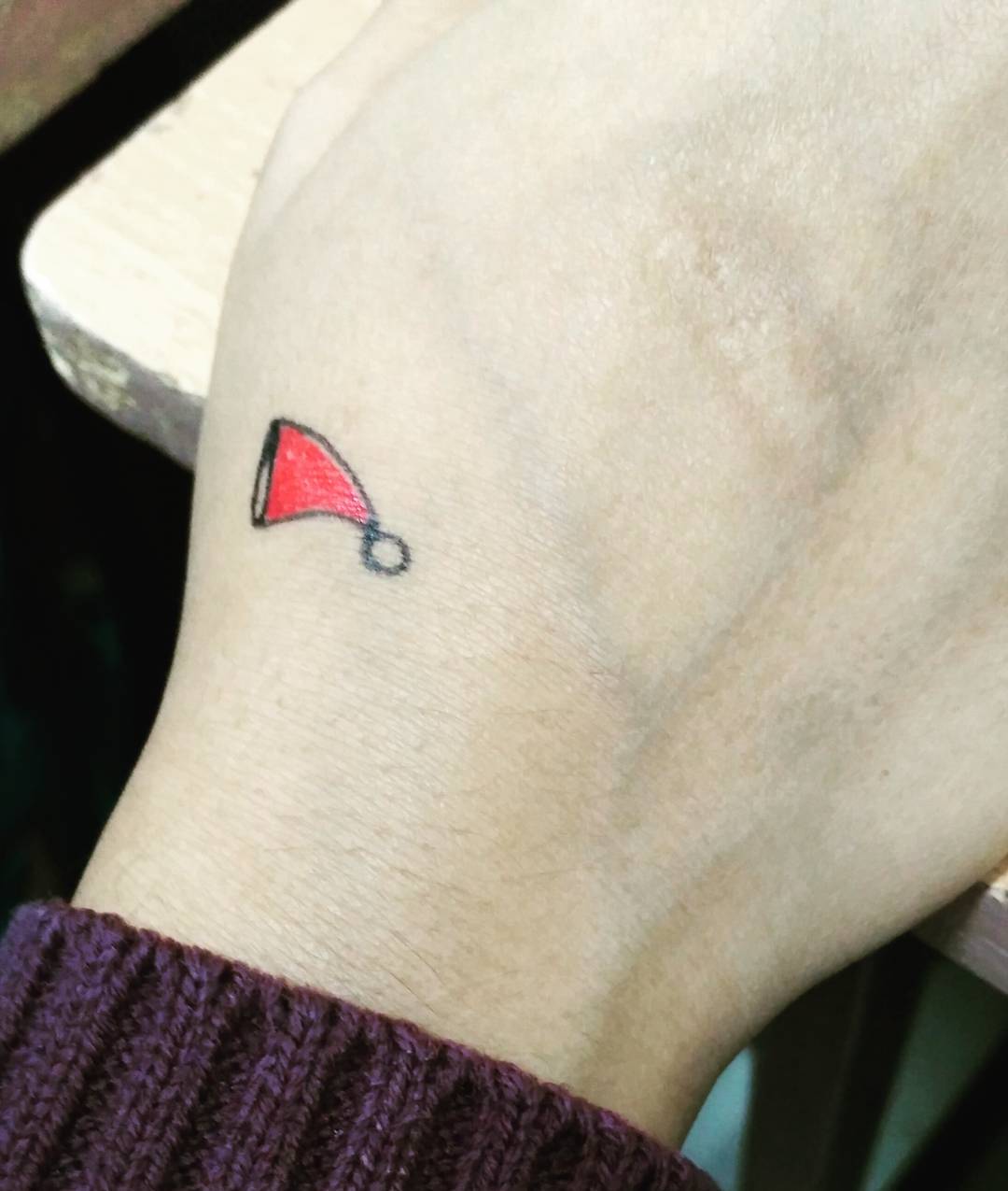 Tiny Merry Christmas Tattoo.