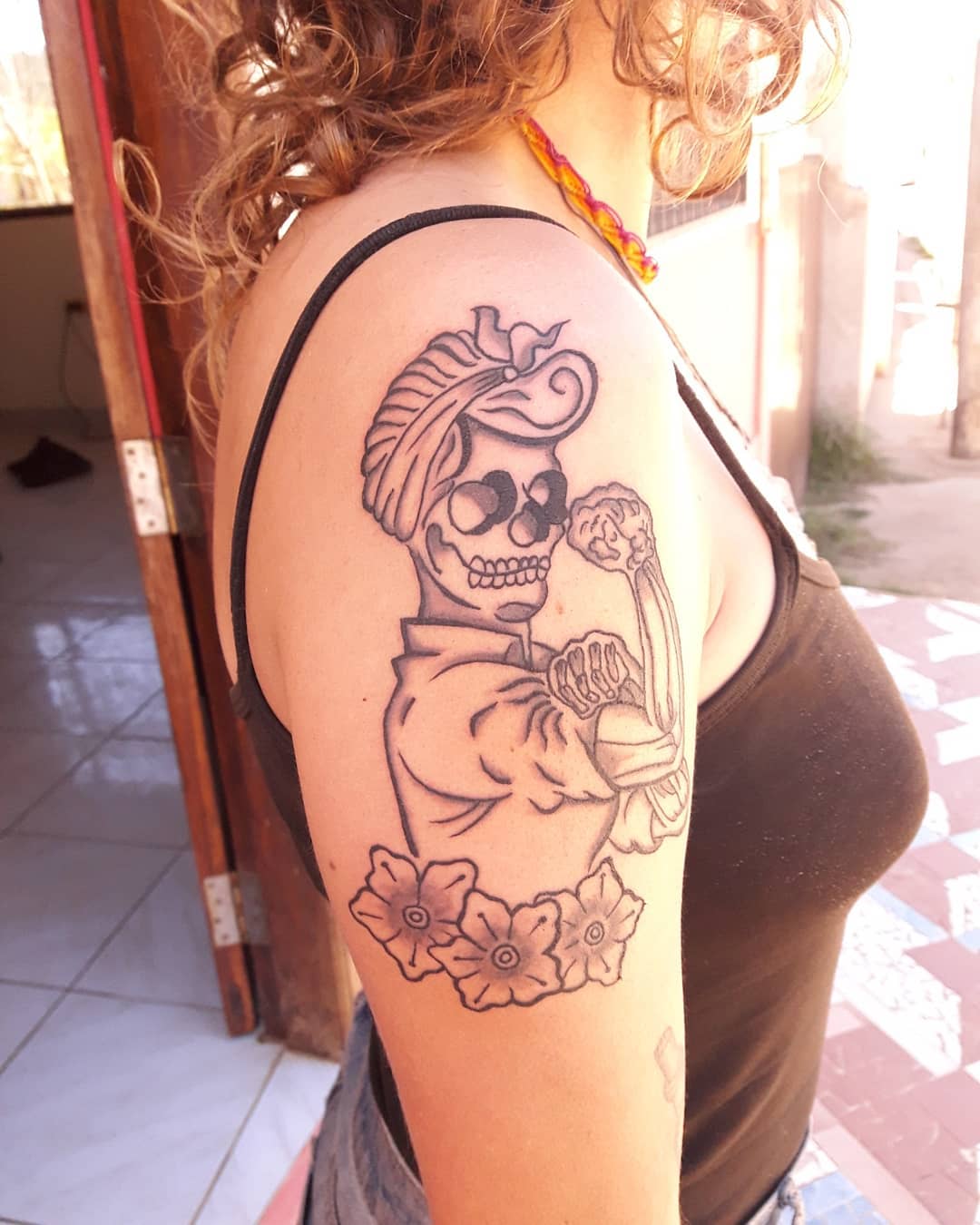 Women skull tattoo showing women power. Pic by samaipatatattoo