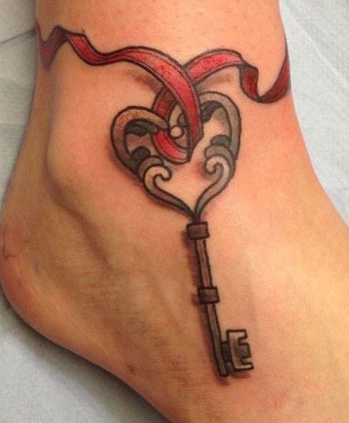 Amazing ribbon key tattoo design on ankle.