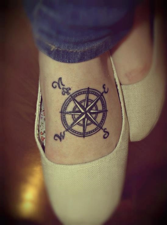 Compass tattoo is always a safe option when you want to imprint something on your foot.