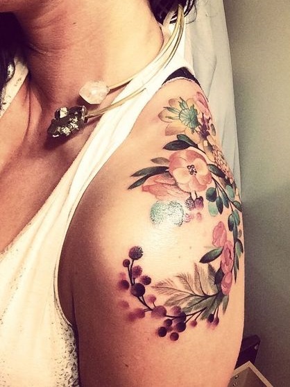 Coverup watercolor flower tattoo designs for women on shoulder.