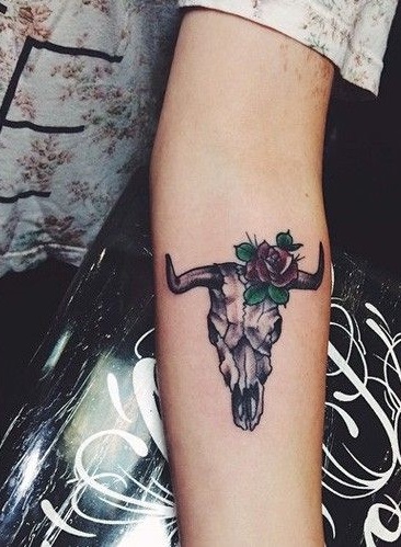 Cow skull tattoo looking on forearm very classic.