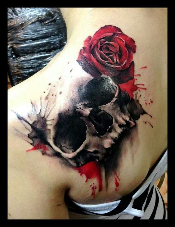 Exclusive 3D skull tattoo with rose looking perfect on shoulder.