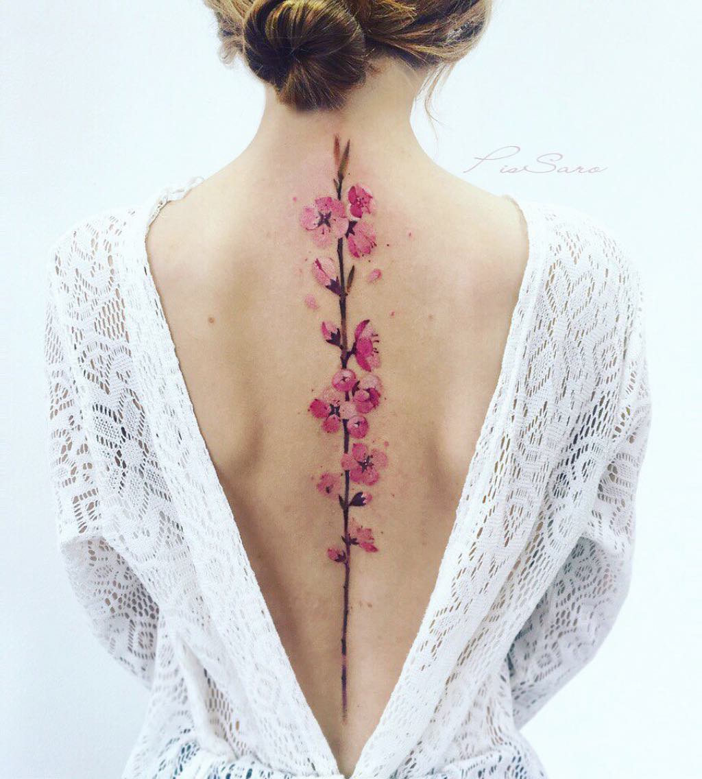 Fabulous flower designs can be take place as spine tattoos for women.