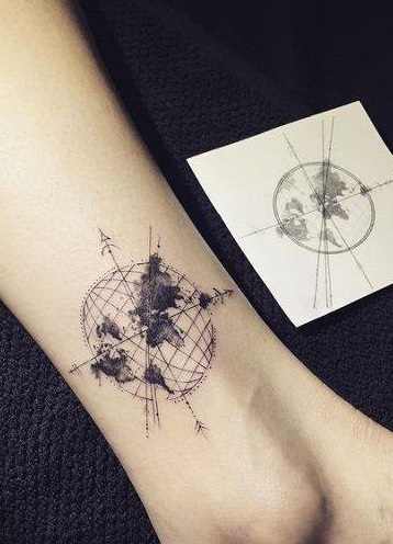 Impressive earth ankle tattoo showing directions.