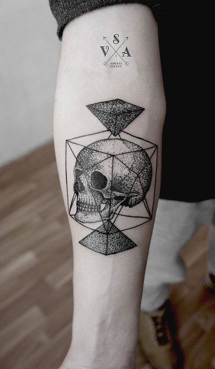 This geometric dotwork skull compass tattoo illustrates proportional shapes.