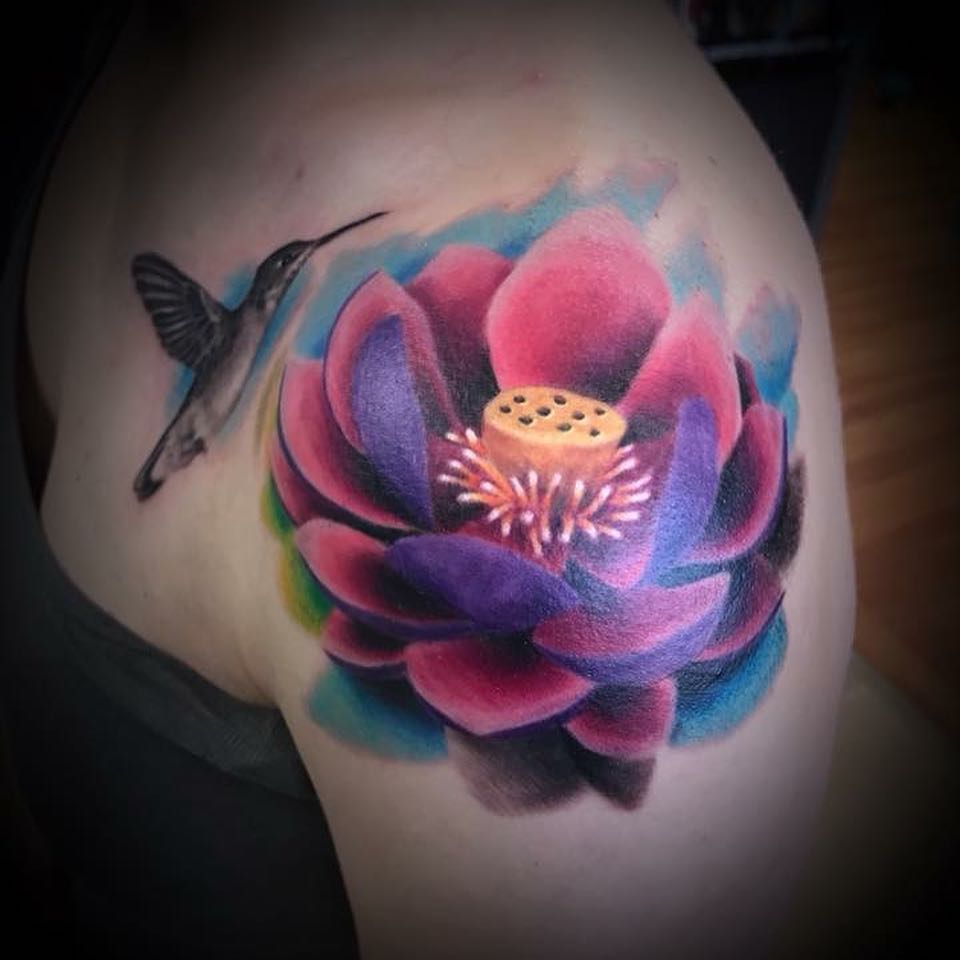 This lotus flower with hummingbird watercolor tattoo on inner arm is awesome design for the girls.