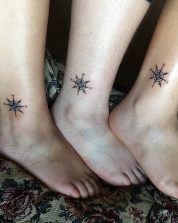 This simple black matching compass tattoo on ankle gives us the way to move together.