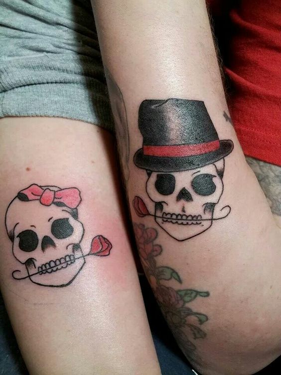 Two lovely couple of skull with roses.