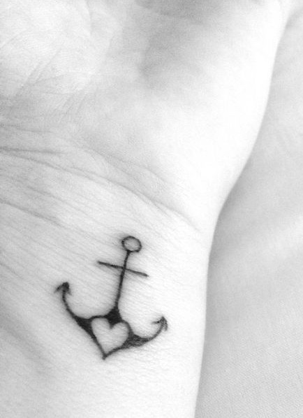 Adding a heart really sweetens up this anchor tattoo design.