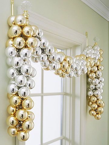Amazing golden and silver ornament garland on window.