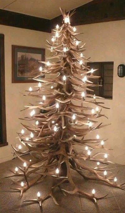 Amazing rustic Christmas tree decorated with lights.