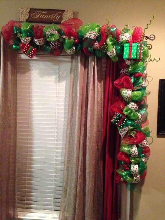 Beautiful red and green garland on window.