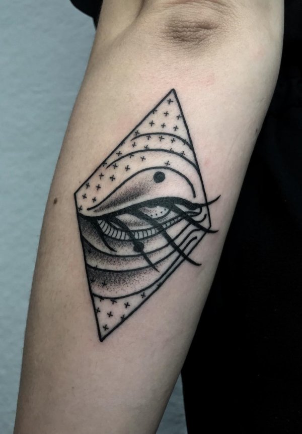 Black and grey dot work and line work killer eye tattoo within diamond.