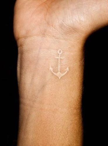 Fabulous white anchor tattoo on wrist.