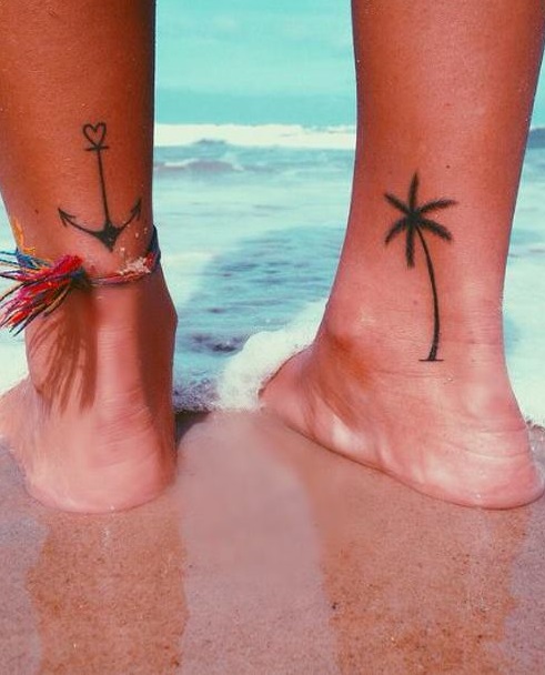 Heart adding anchor on one leg and palm tree on other.