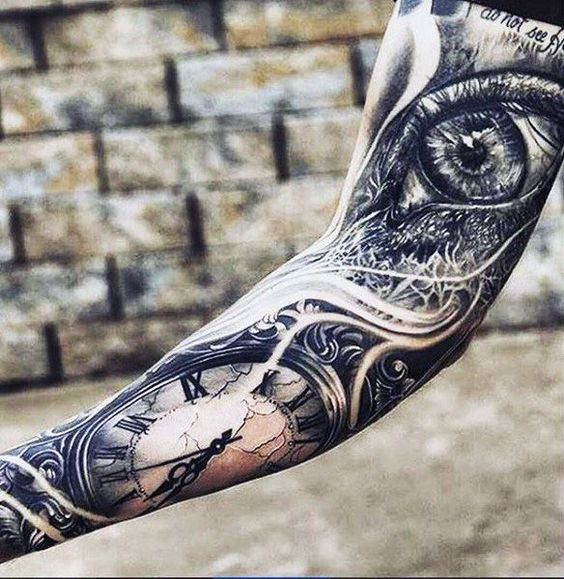 Impressive coverup full sleeve tattoo of eyeball with clock.