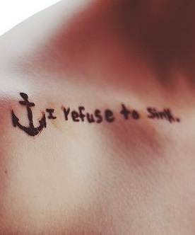 Pretty collar bone anchor tattoo with lettering.