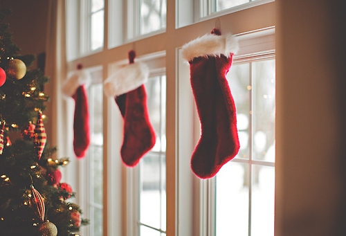 Red stocking hanging on window.
