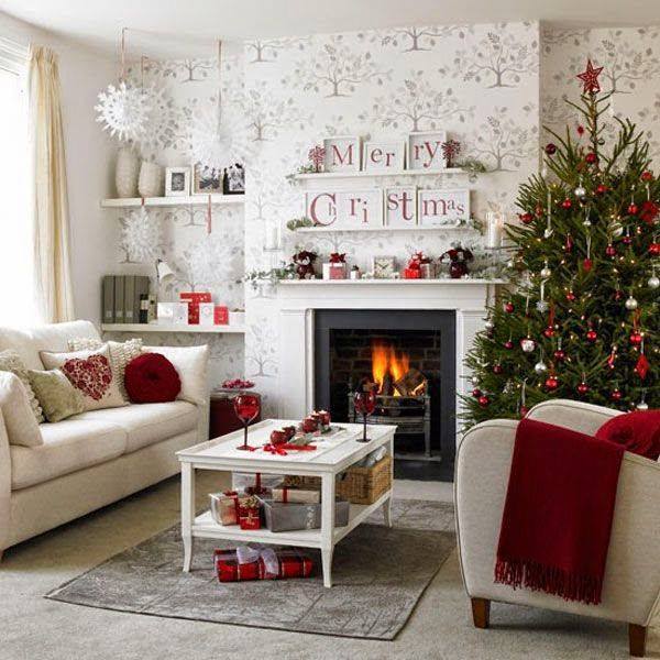 Romantic red and white Christmas living room decor with tree, snowflakes and sign board.