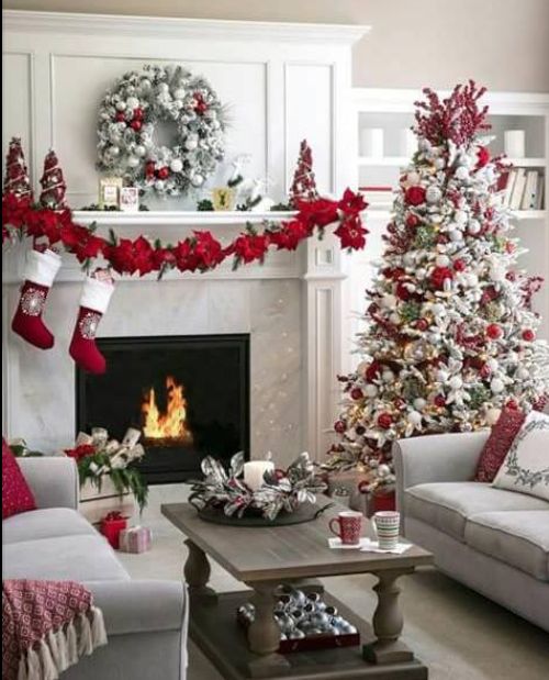 White Christmas tree decorated with red ornaments, red garland and wreath perfect for Christmas living room decoration. Christmas Decorating Ideas