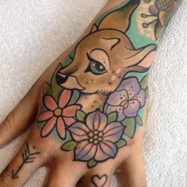 Admire animals and a cute deer emerging with various flowers tattoos.