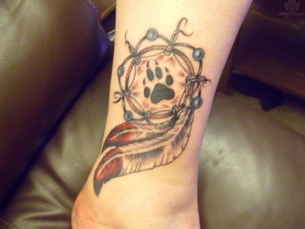 Adorable dog paw tattoo on dreamcatcher.