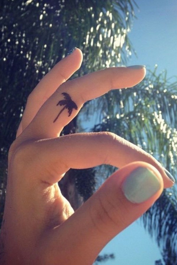Adorable palm tree finger tattoo design.