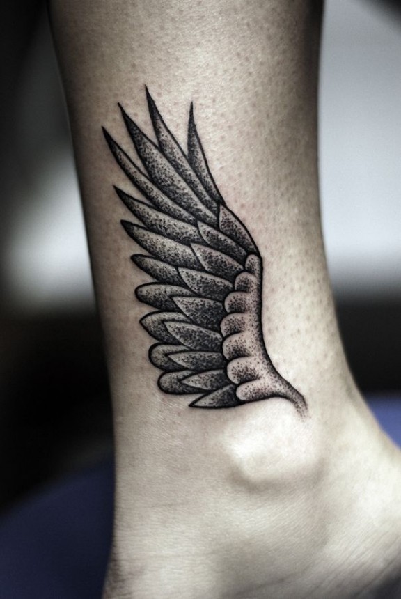 Angel wing, black and grey tattoo right here.