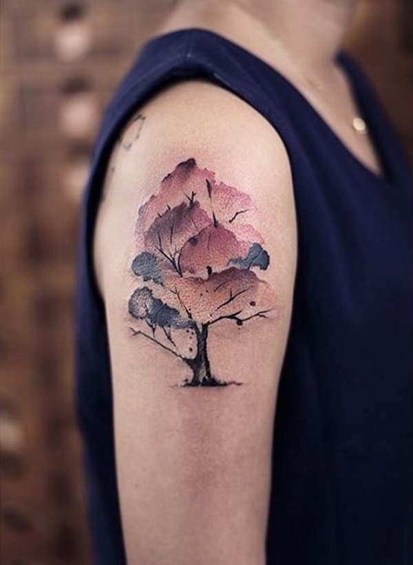 Awesome watercolor tree tattoo on upper arm.