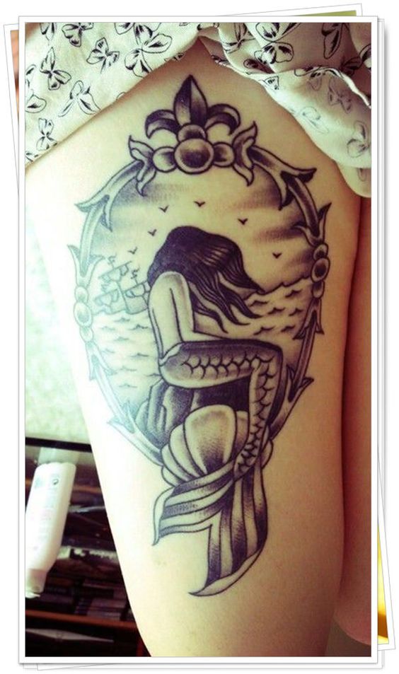 Beautiful mermaid tattoo on thigh.
