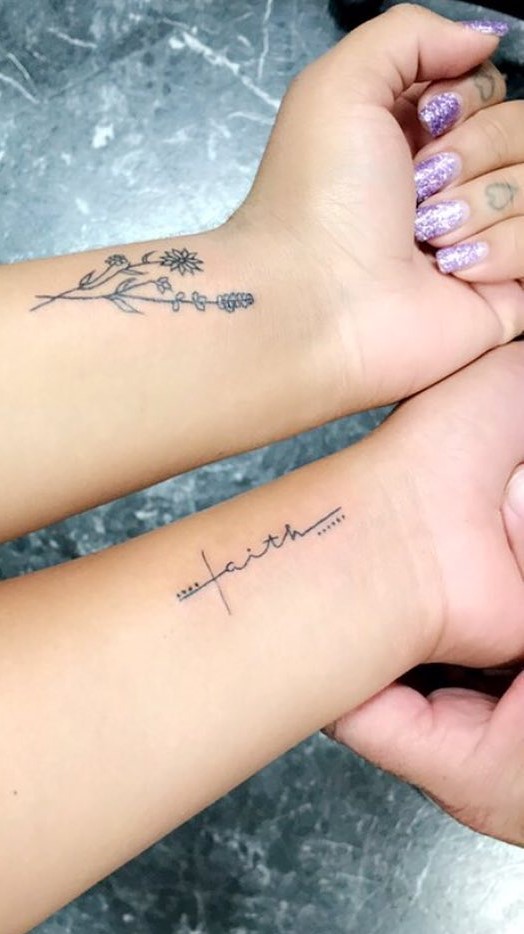 Black And Gray Flower Tattoo On Wrist.