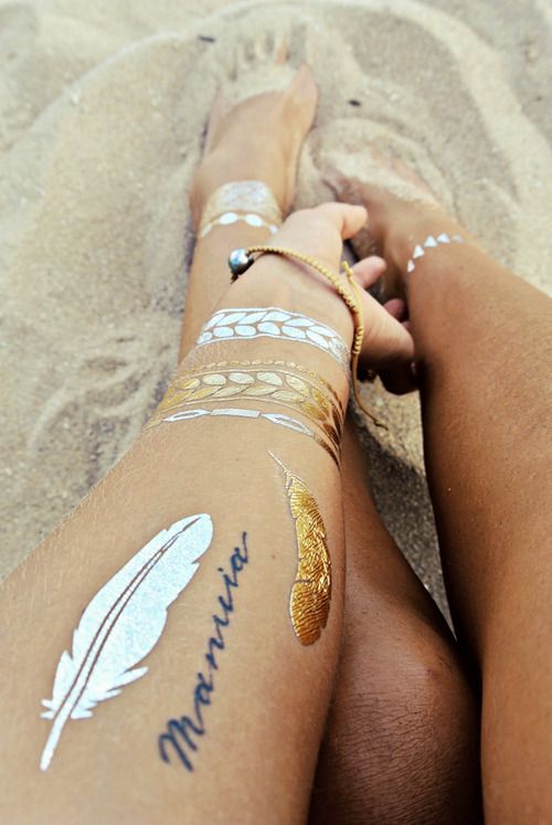 Boho white & golden feather tattoos.