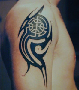 Celtic tribal tattoos on bicep.