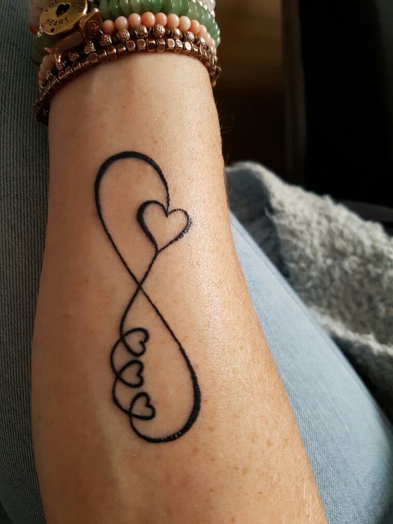 Charismatic Infinity Tattoo With Hearts.