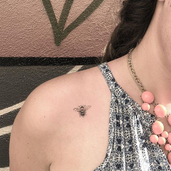 Chic bee shoulder tattoo.