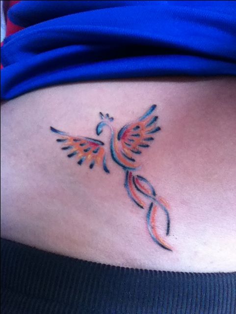 Colorful small phoenix tattoo.