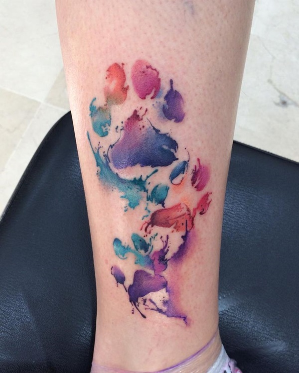 Cool watercolor paw tattoo.