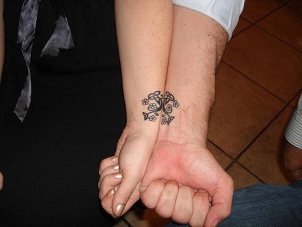 Creative celtic tattoo on wrist for couple.