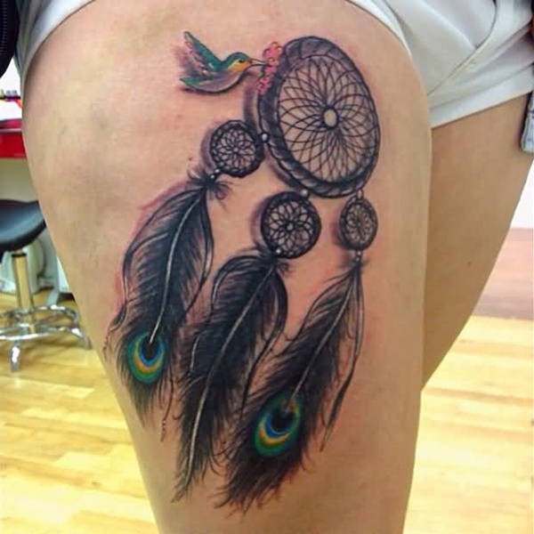 Cute dreamcatcher tattoo with bird and peacock feathers.