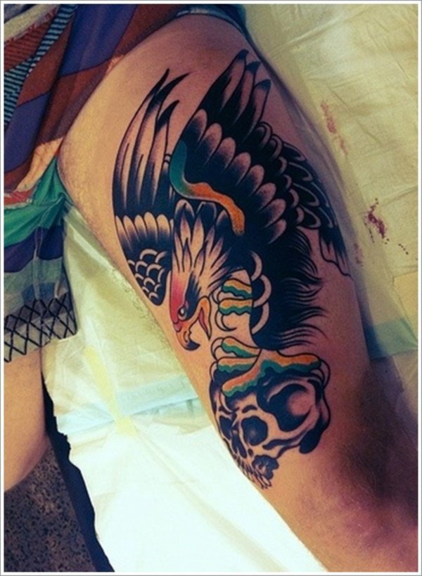 Decor your thigh with eagle and skull tattoo this way.
