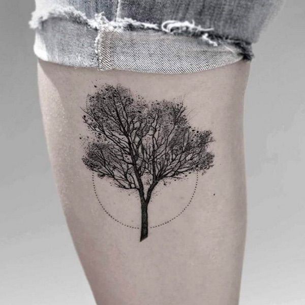Dot work tree tattoo on thigh.