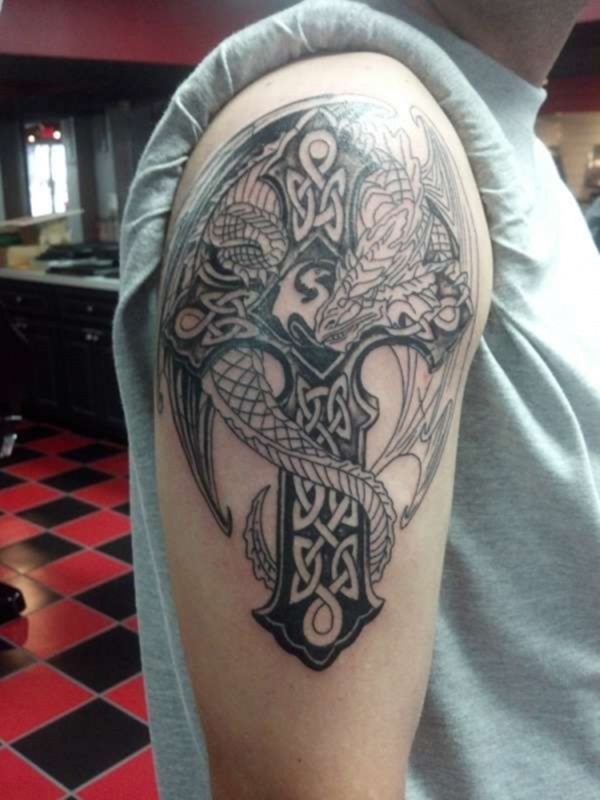 Dragon covering the celtic cross.