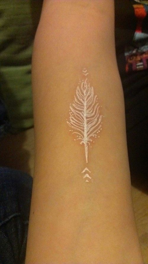 Fabulous white feather tattoo on arm.