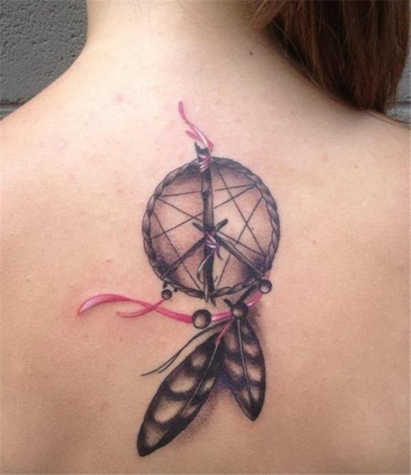 Feminine dreamcatcher tattoo on back.